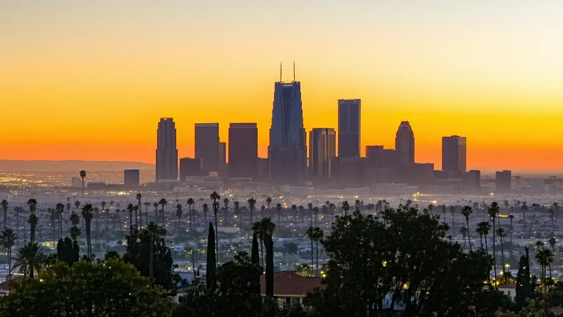 Los Angeles city at dusk with warm amber and coral light — creative tech company in LA concept